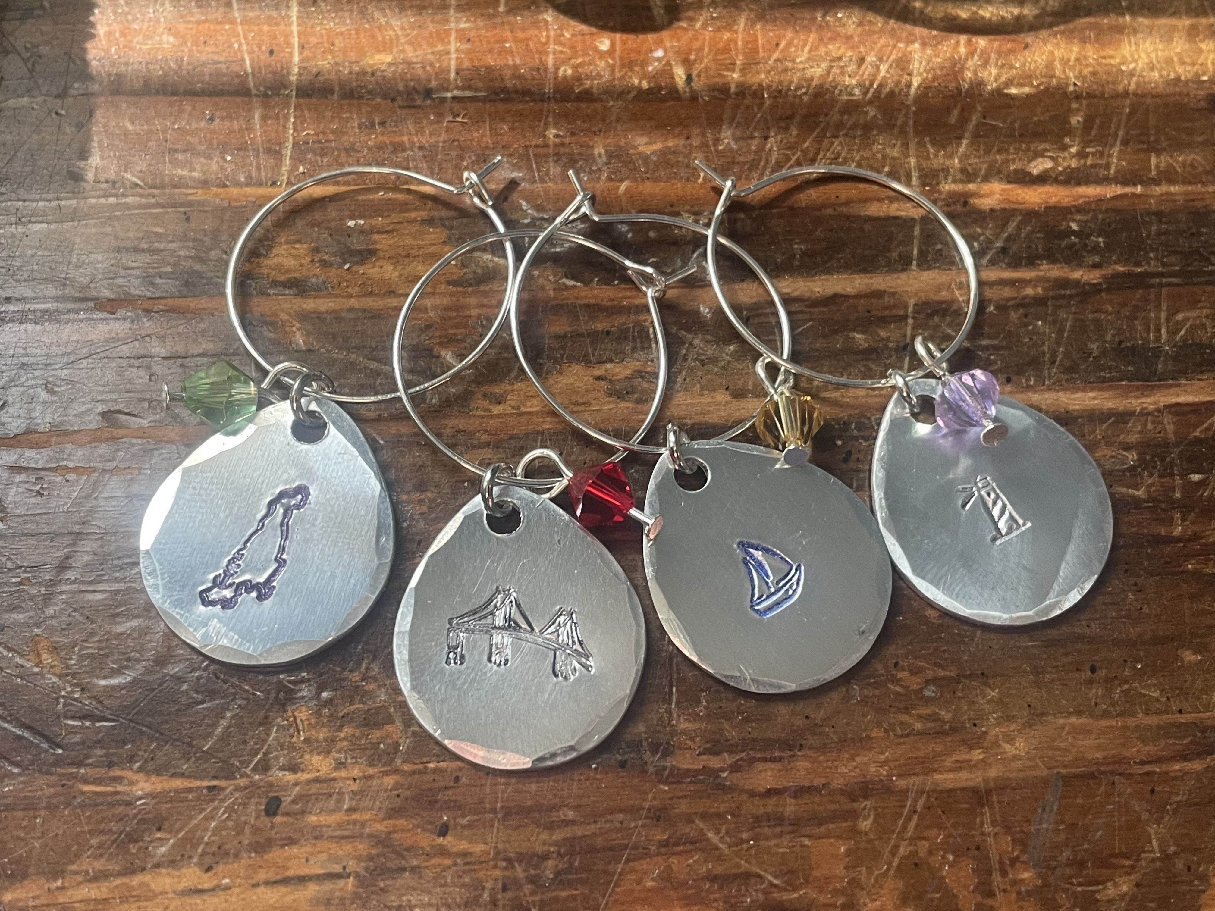 Aquidneck Island Wine Charm  comes in a set of 4 and they are made in Rhode Island